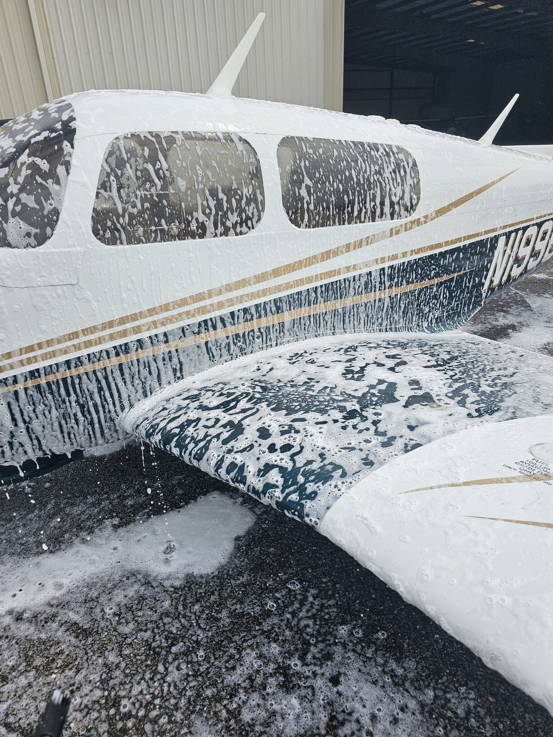 Aircraft covered in cleaning foam